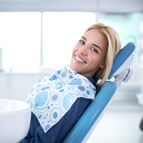 Smiling woman sitting in dental office