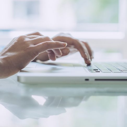 Person typing on a laptop