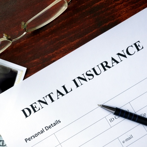 Dental insurance paperwork on desk