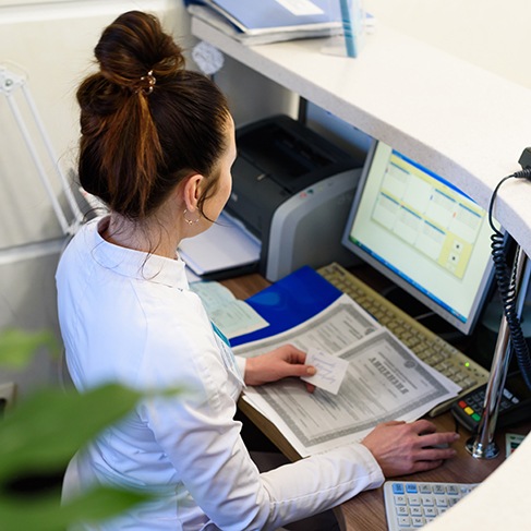 Receptionist at a computer