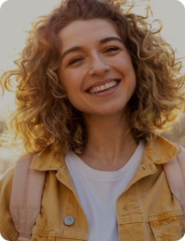 Smiling woman in yellow jacket